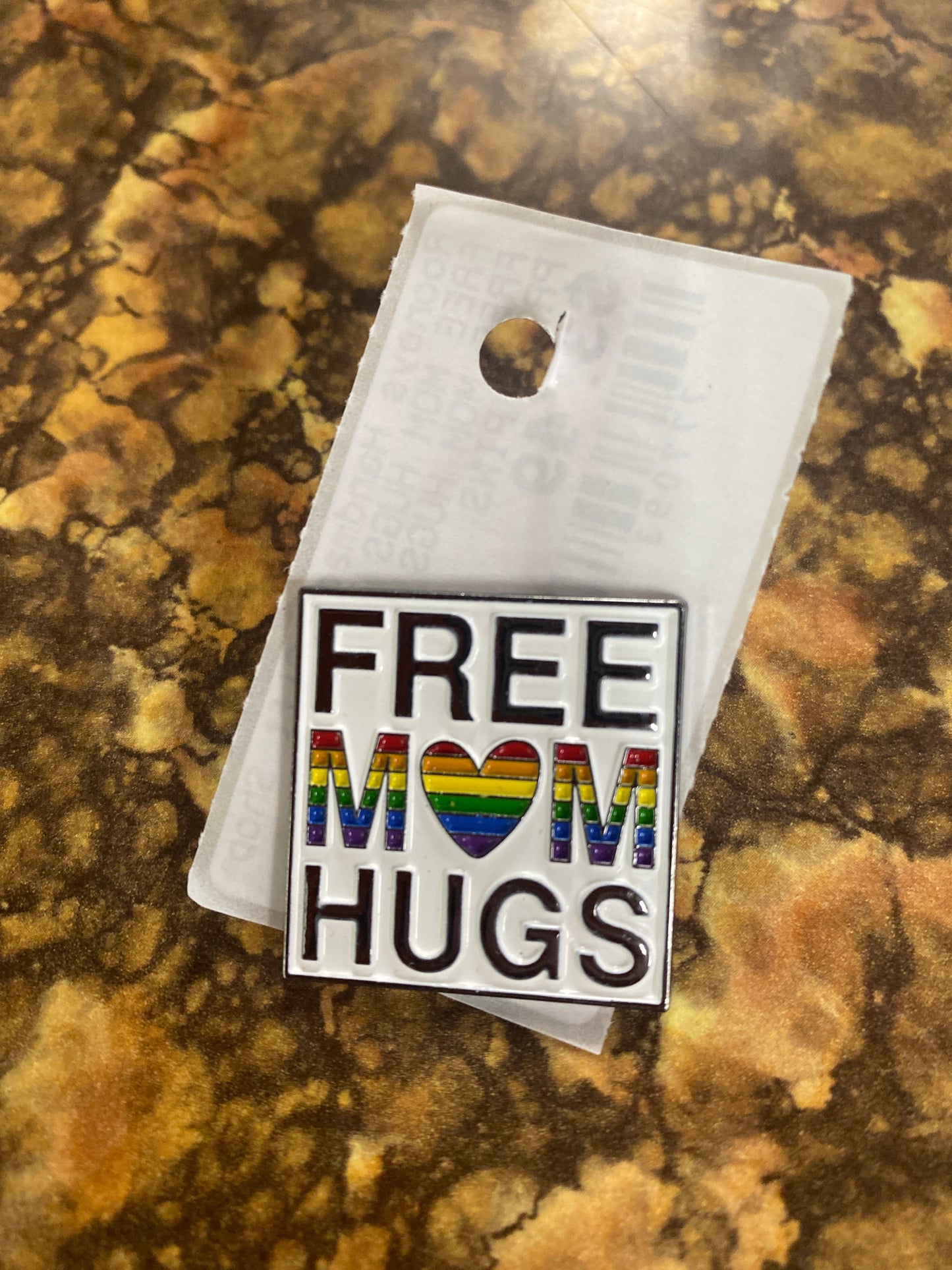 FREE MOM HUGS PIN