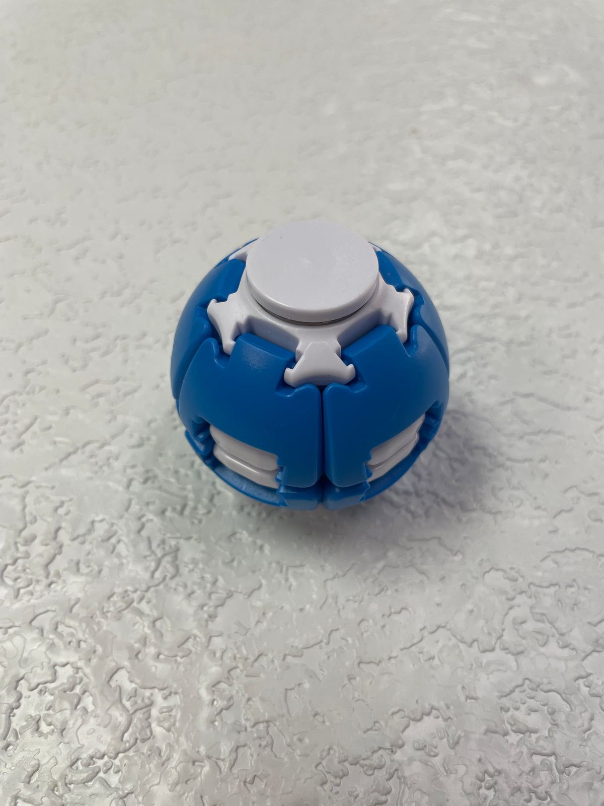 PRESS TO SPIN FIDGET BALL BLUE WHITE