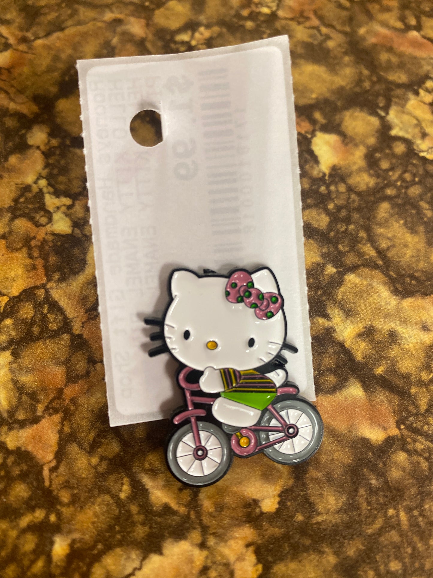 HELLO KITTY ON BIKE ENAMEL PIN