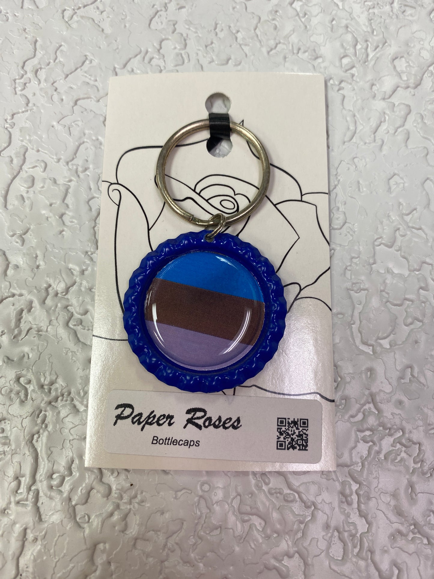 BLUE PRIDE BOTTLE CAP KEYCHAIN