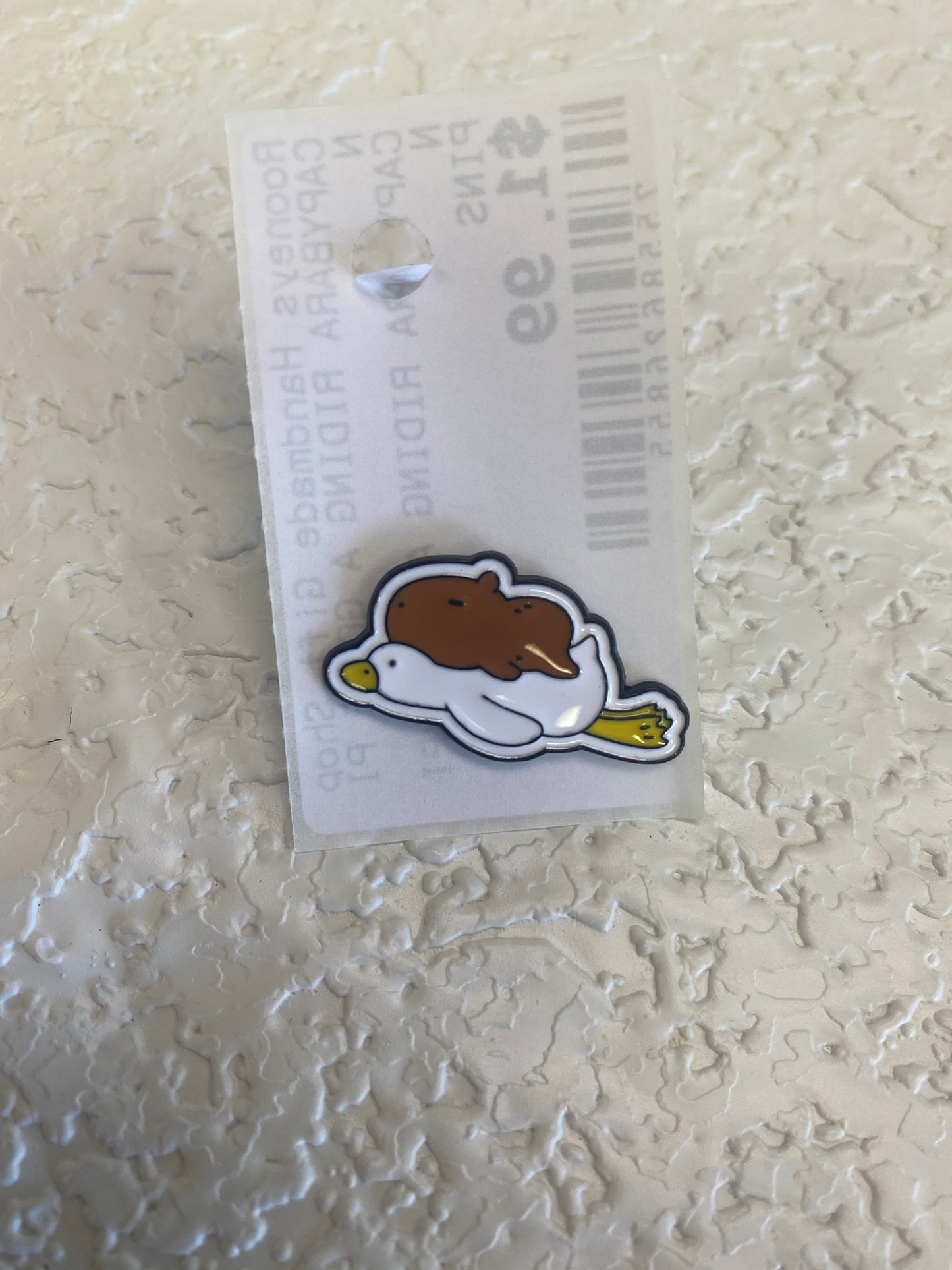 CAPYBARA RIDING A GOOSE PIN