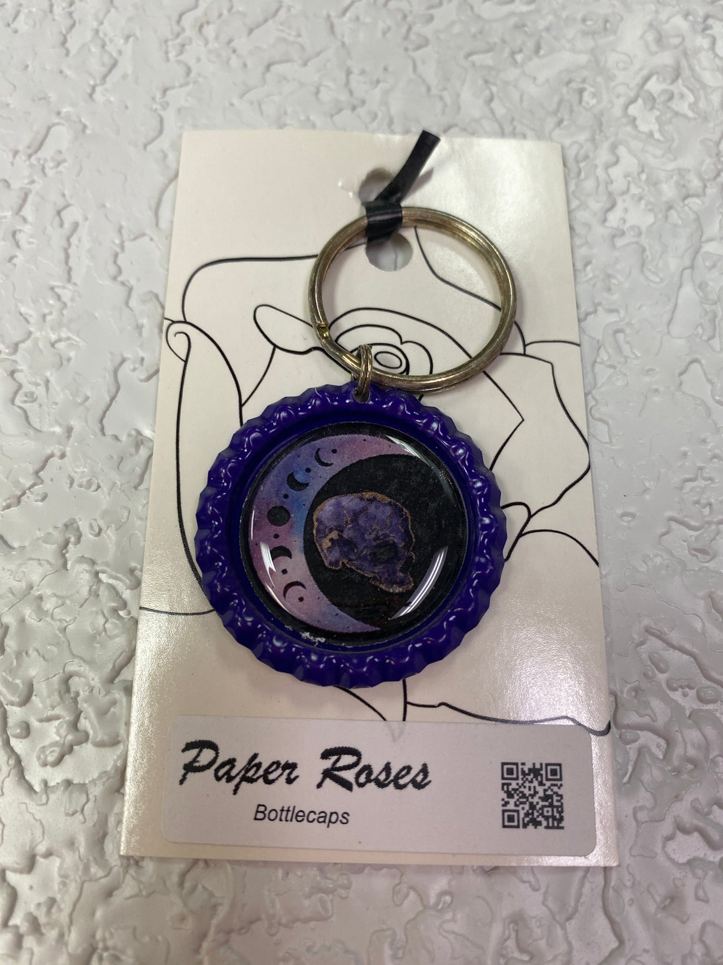PURPLE MOOS SKULL BOTTLE CAP KEYCHAIN