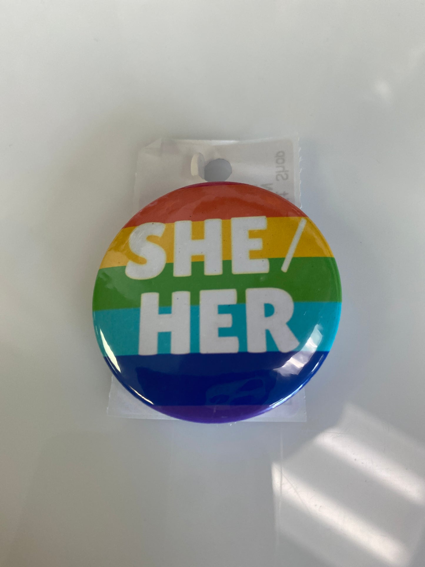 SHE HER RAINBOW BUTTON