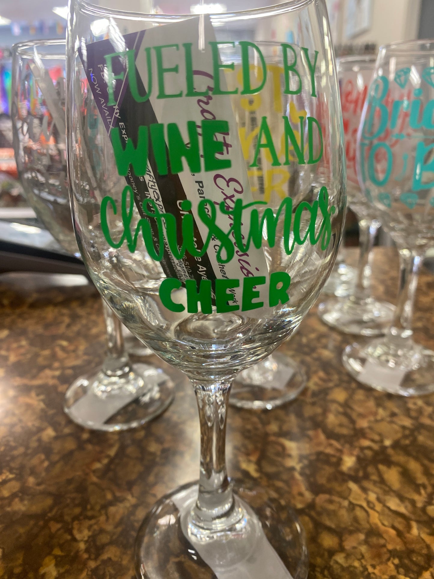 Wine glass fueled by wine and xmas cheer green