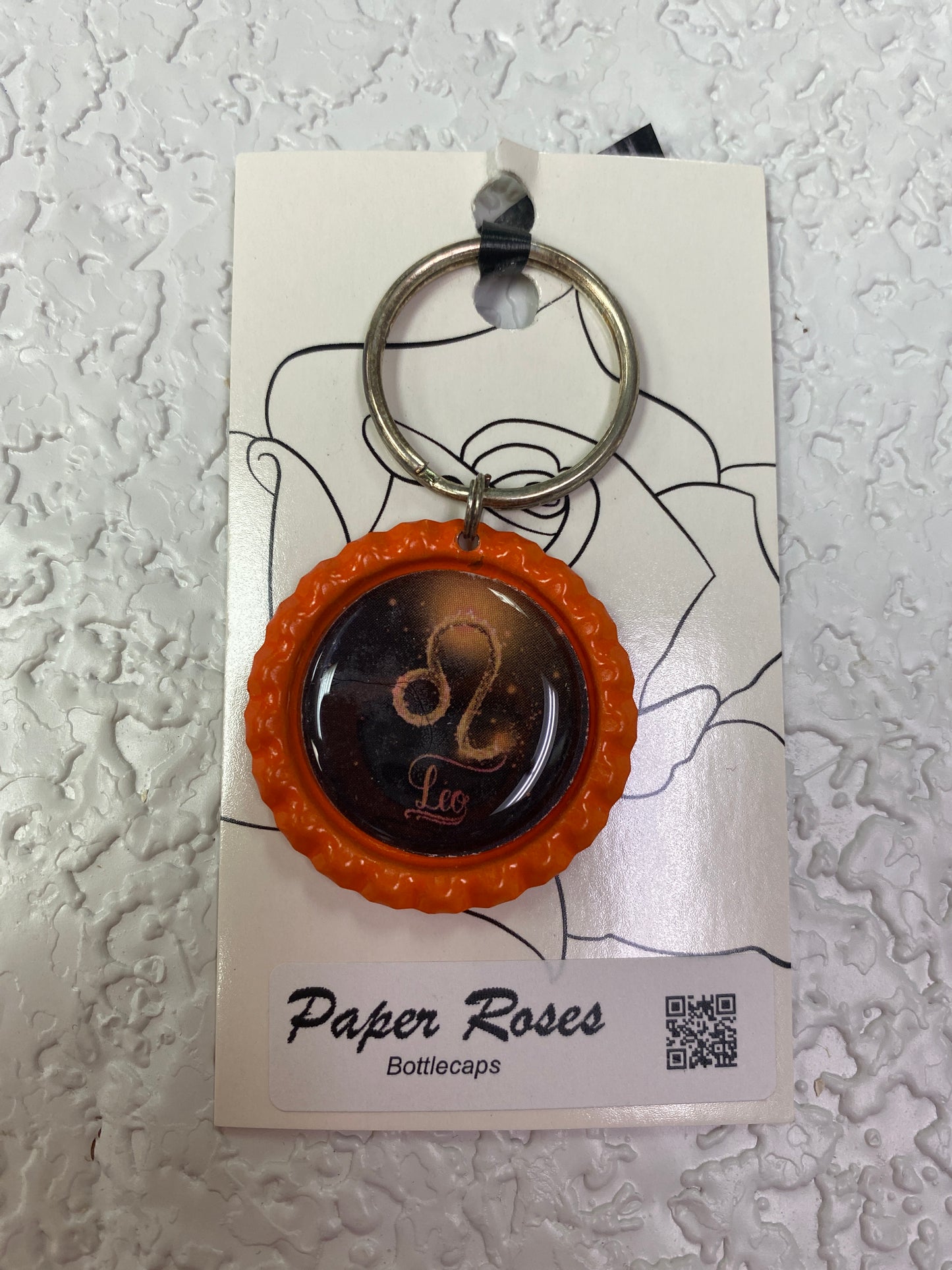 ORANGE LEO BOTTLE CAP KEYCHAIN