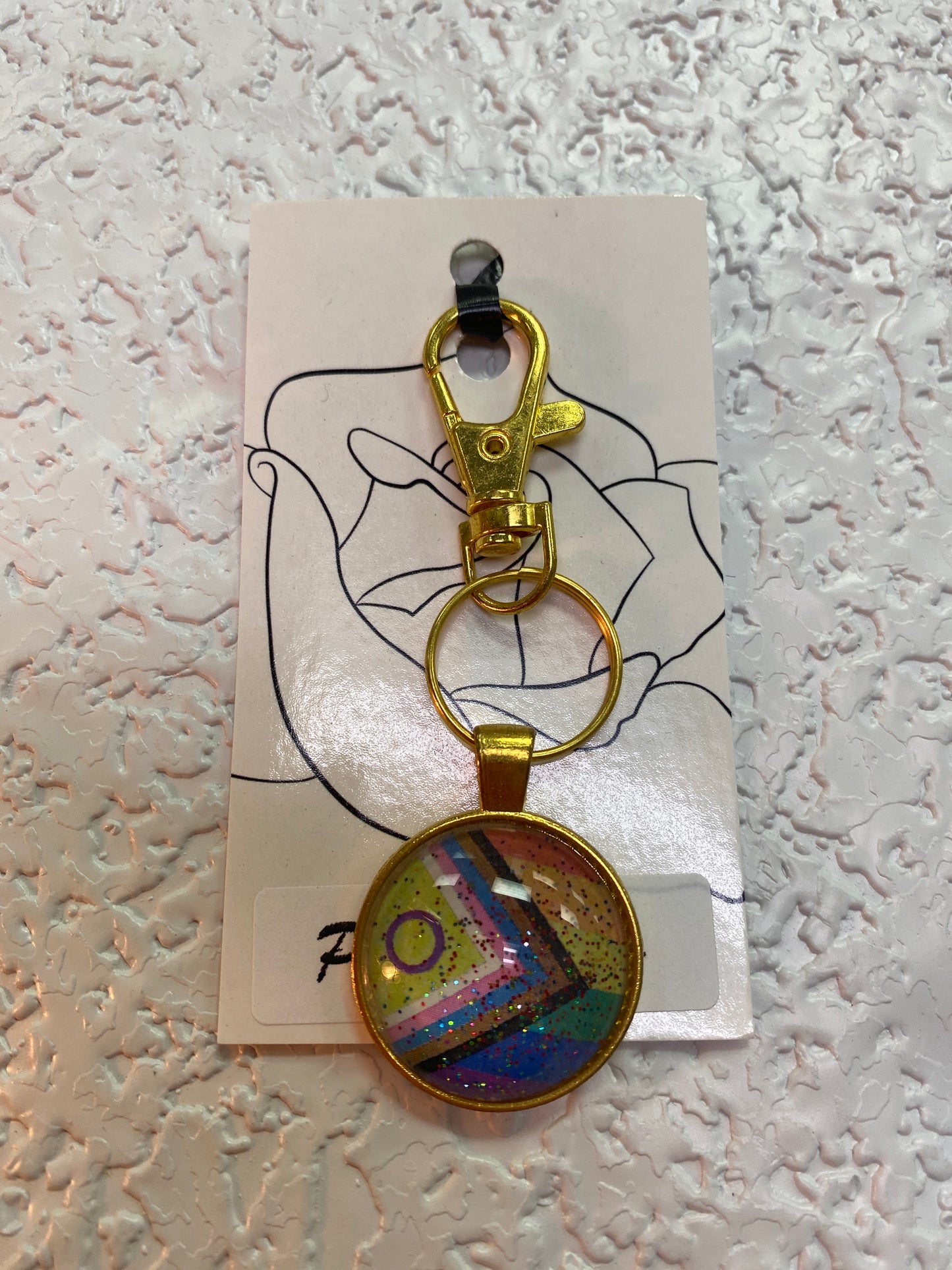 NEW PROGRESS FLAG GOLD KEYCHAIN