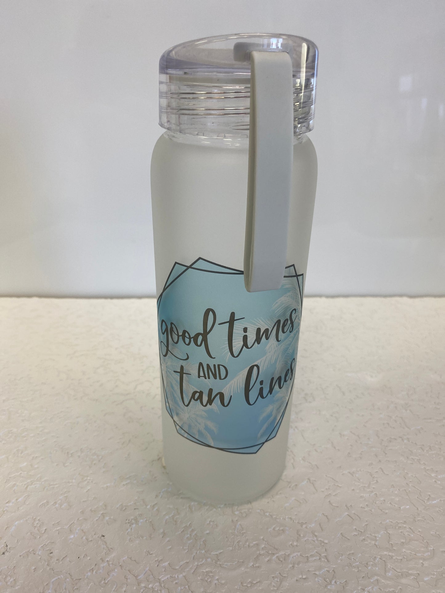 GLASS BOTTLE GOOD TIMES AND TAN LINES