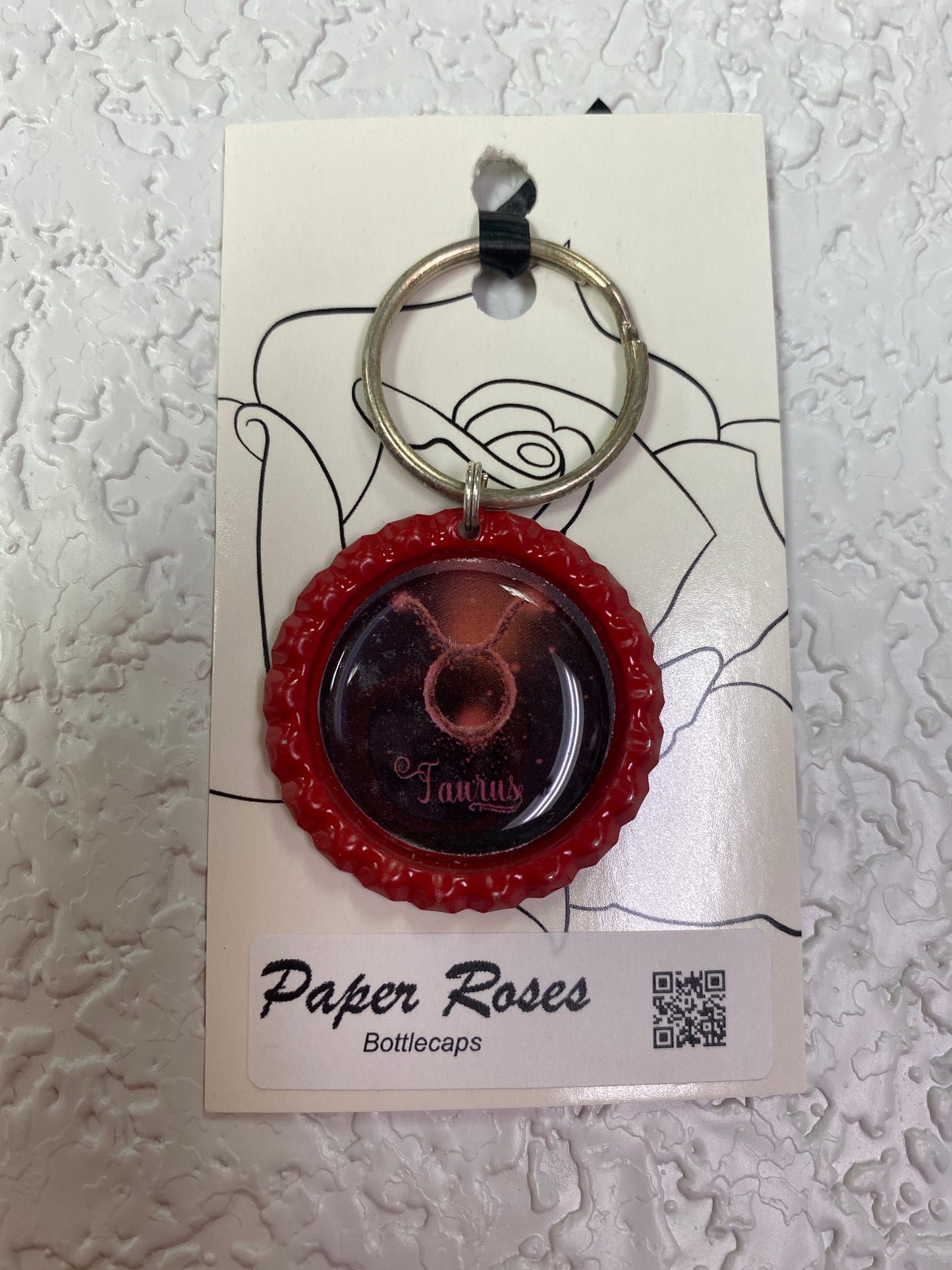 RED TAURUS BOTTLE CAP KEYCHAIN