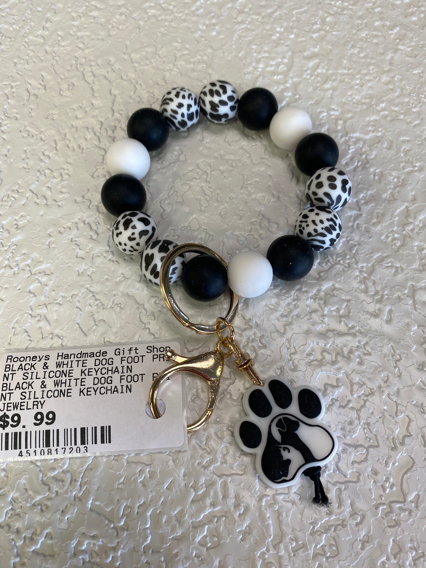 BLACK & WHITE DOG FOOT PRINT SILICONE KEYCHAIN