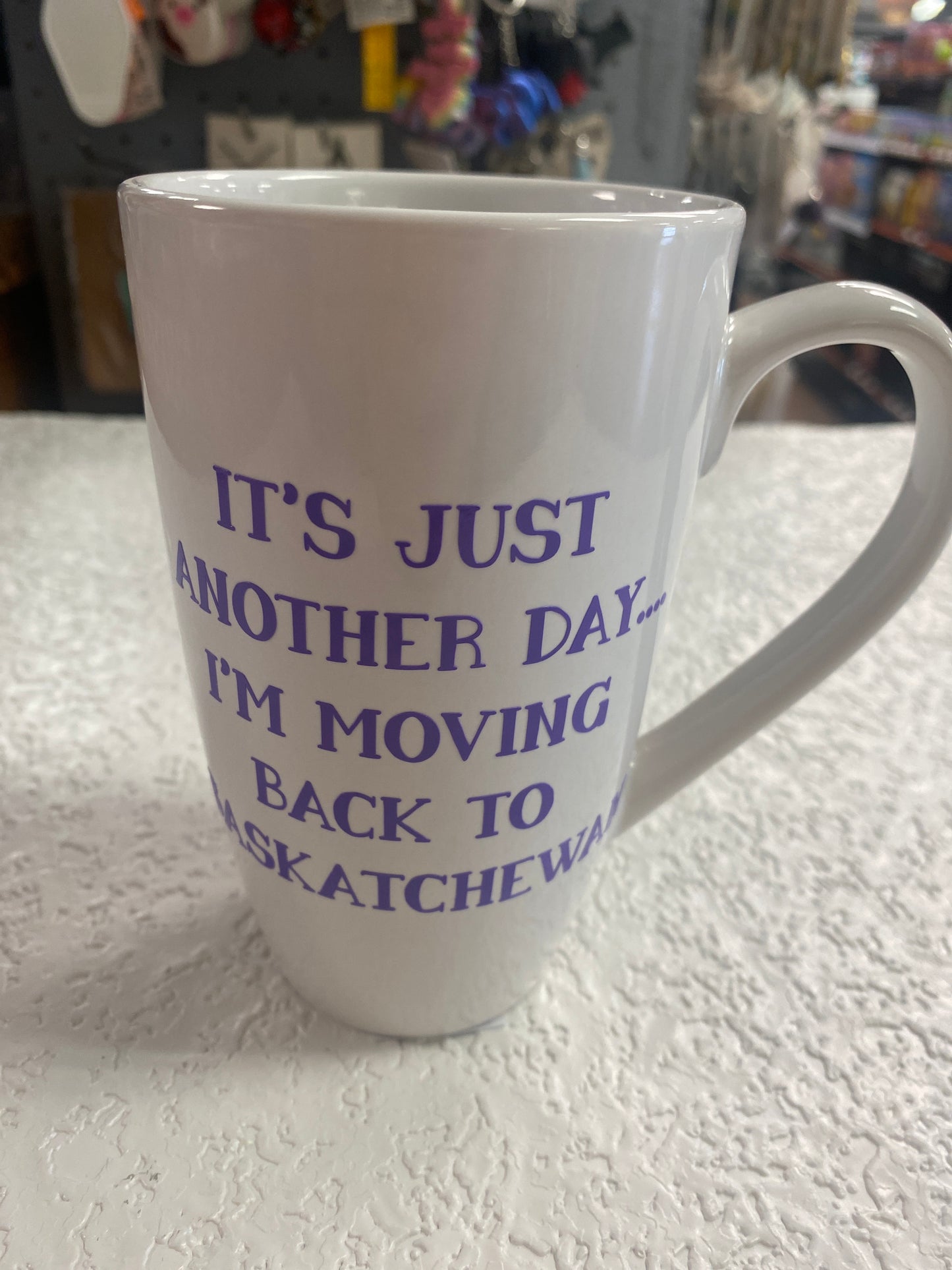 WHITE COFFEE MUG IM MOVING TO SASKATCHEWAN PURPLE