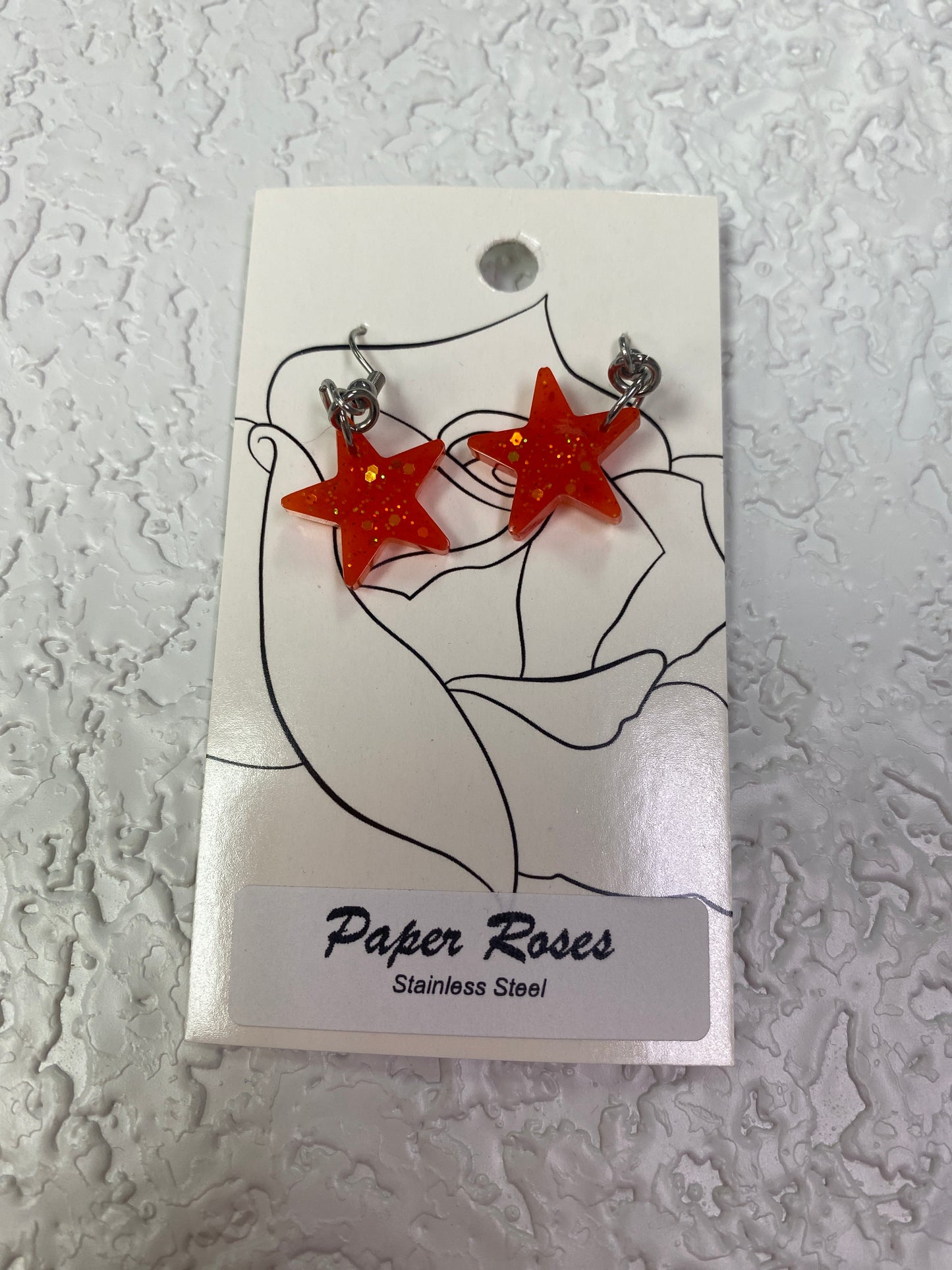 ORANGE RESIN STAR EARRINGS