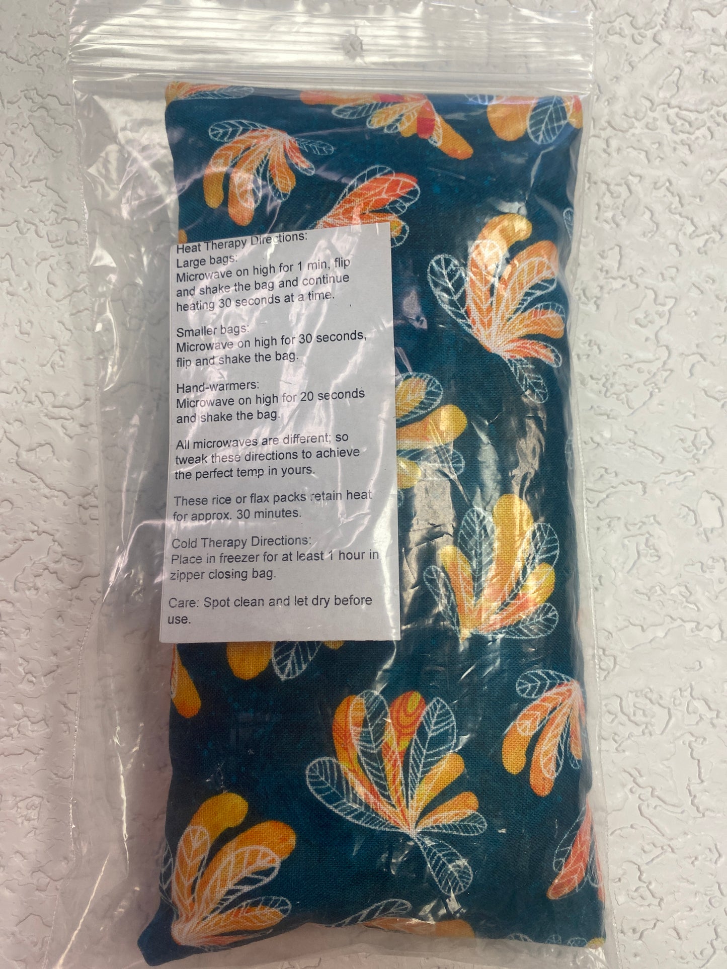 DARK TEAL ORANGE PLANT EYE PILLOW