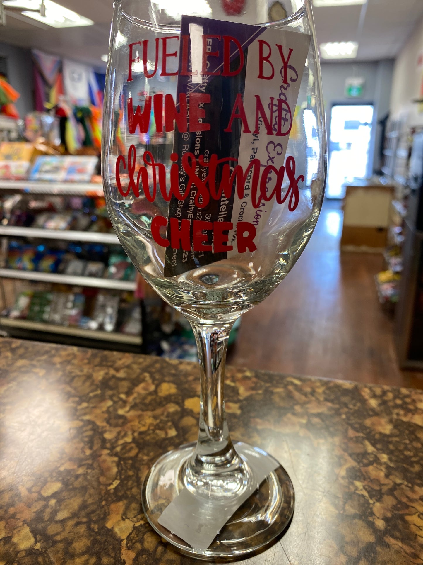 Wine glass fueled by wine and xmas cheer red