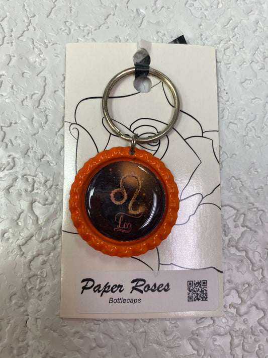ORANGE LEO BOTTLE CAP KEYCHAIN