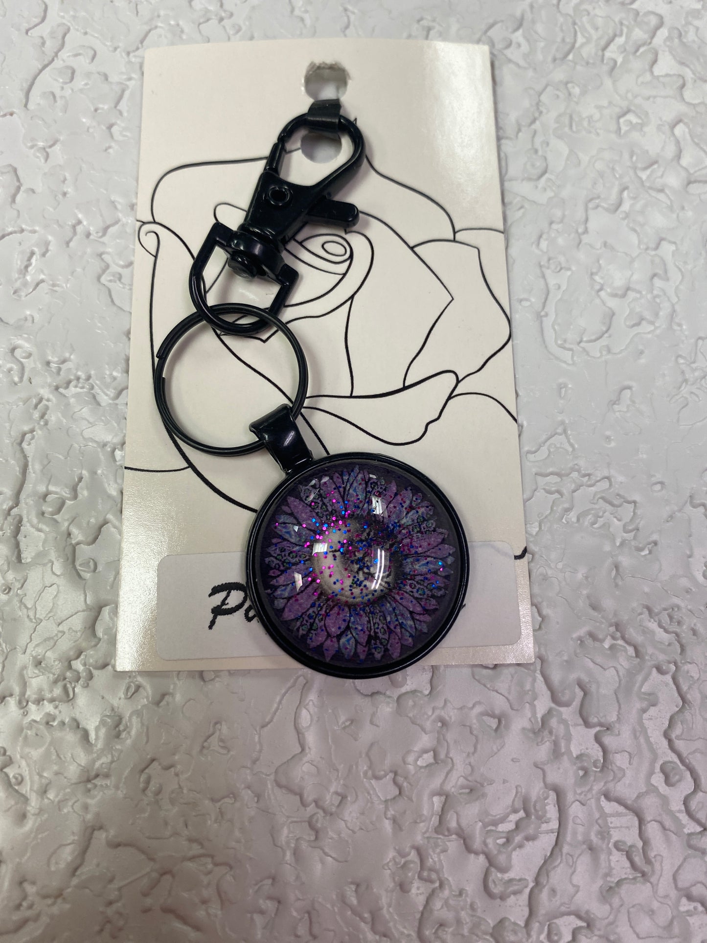 PURPLE FLOWER BLACK KEYCHAIN