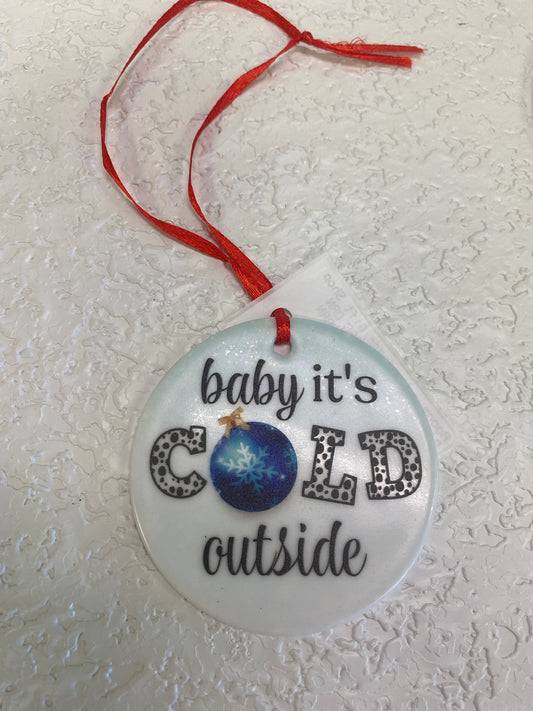 BABY ITS COLD GLASS ORN