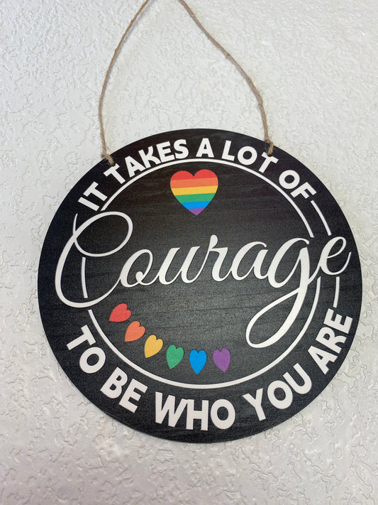 IT TAKES A LOT OF COURAGE ROUND SIGN