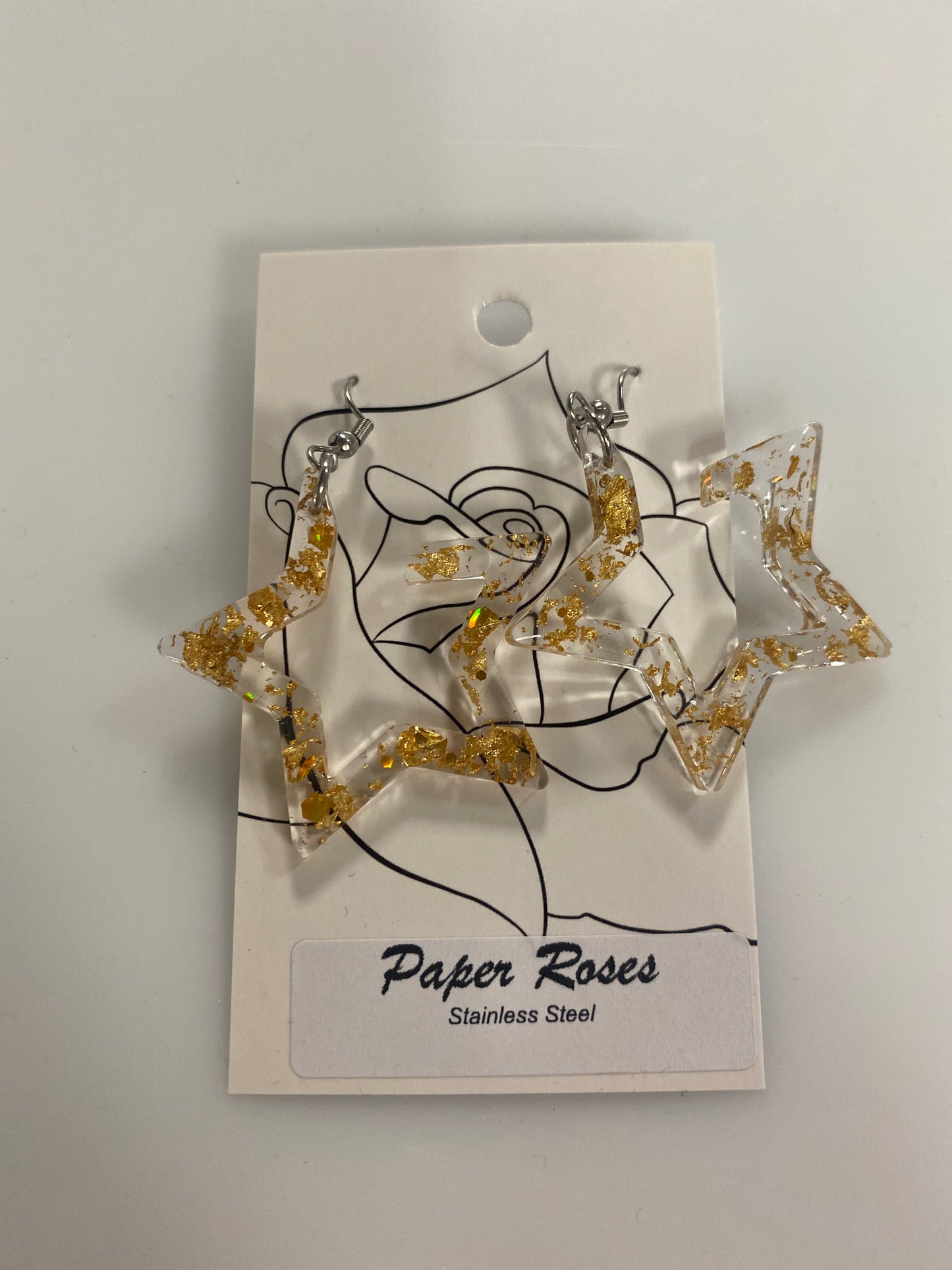 GOLD STAR DANGLING EARRINGS