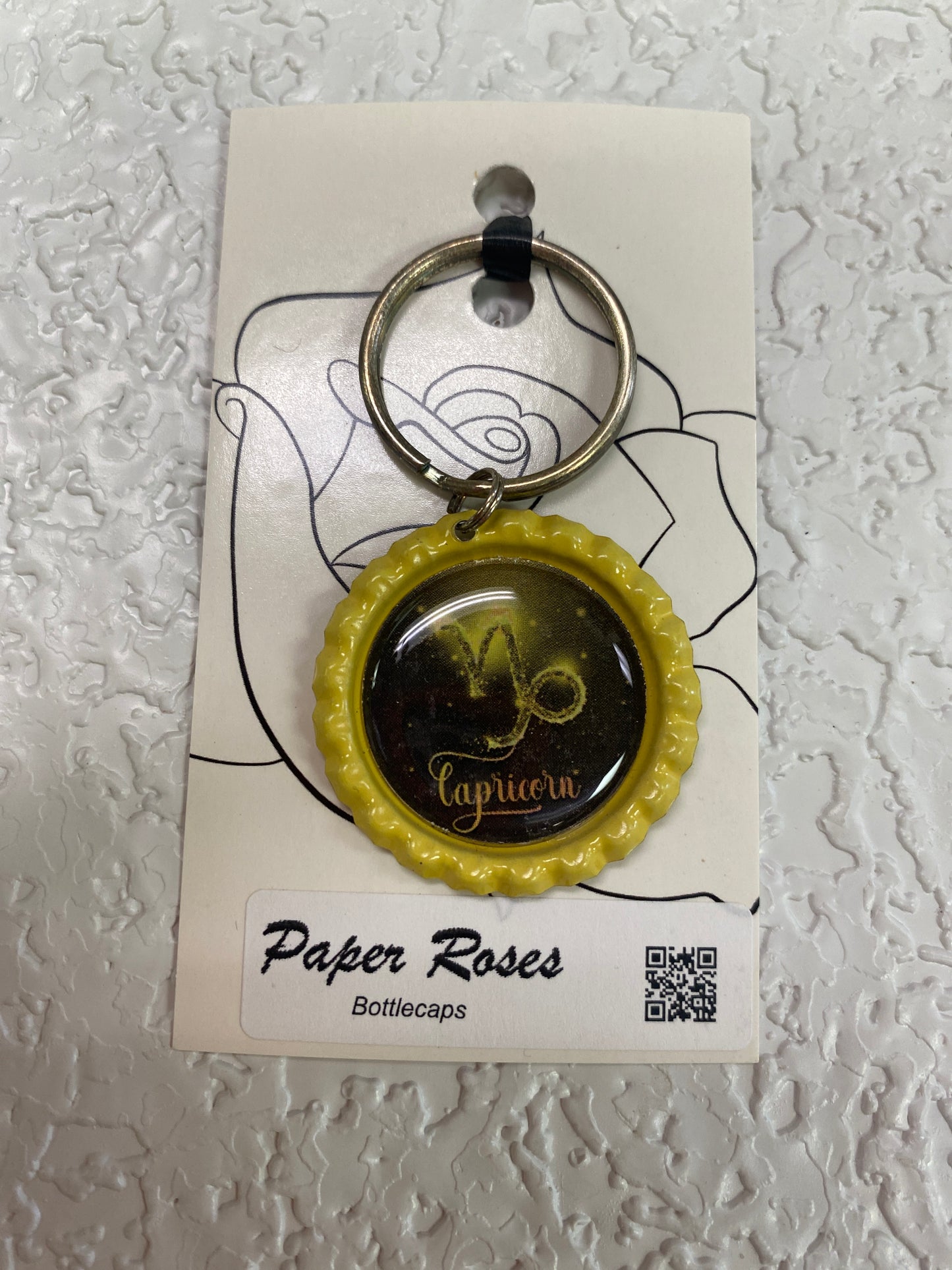 YELLOW CAPI BOTTLE CAP KEYCHAIN